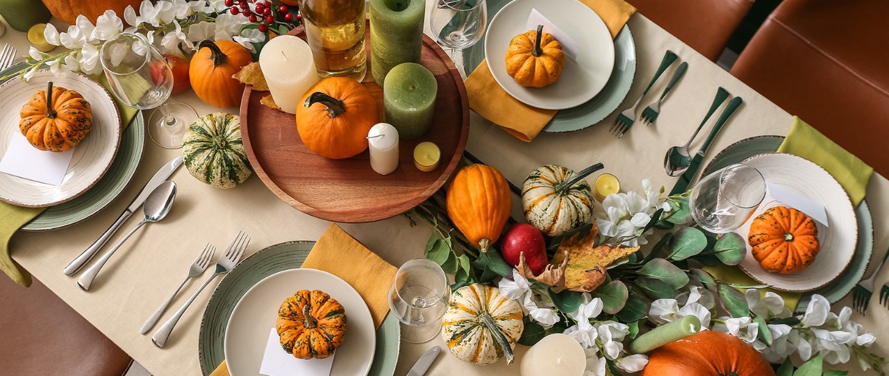 Tablescape with pumpkins in orange, green and mixed.